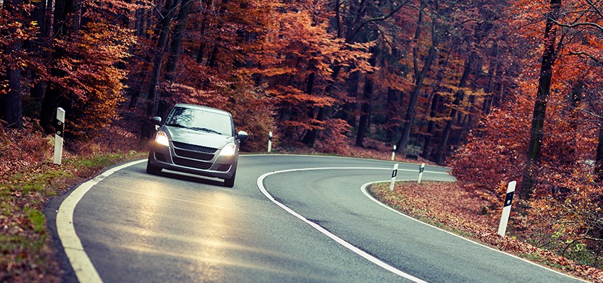 Vehicle-on-Curvy-Road-with-Headlights-On